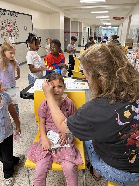 Girl getting face painted