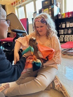 Student holding goat