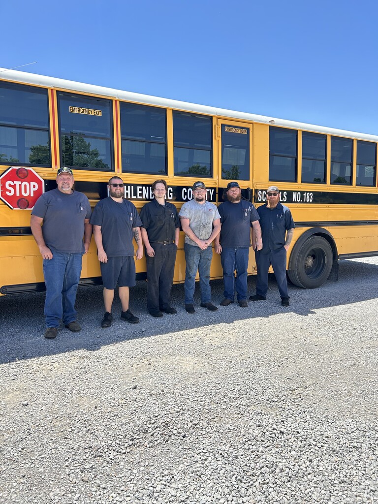Bus garage staff with students