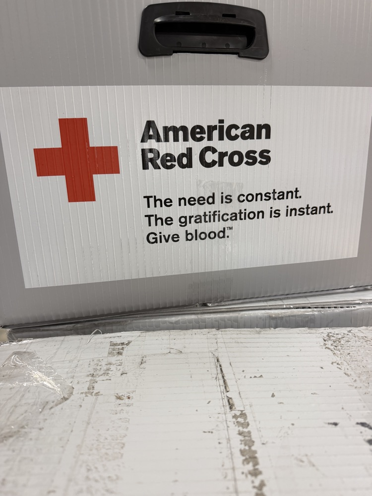 Red Cross sign on box