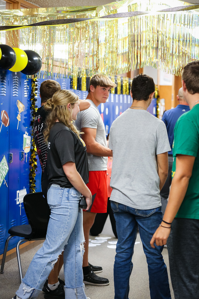 Seniors decorating hallway