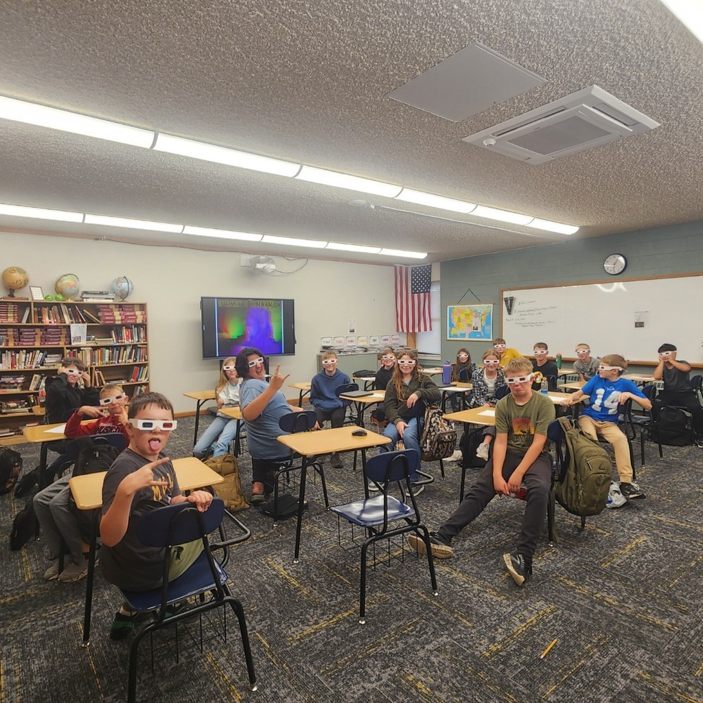 6th grade class using 3D glasses to take notes on Ancient Egypt 