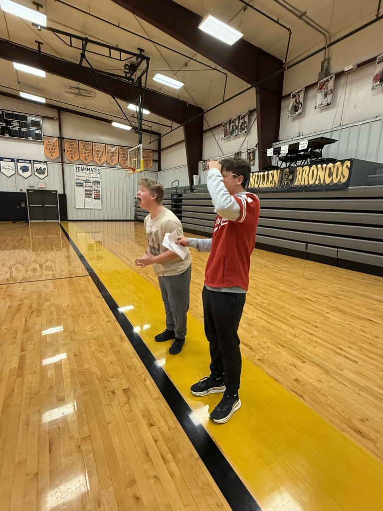 Two students help guide their other tribute to safety