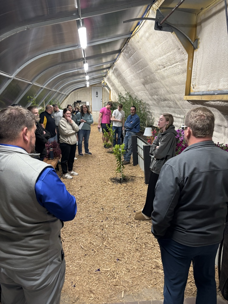 Sydnee shared her research in the greenhouse. 