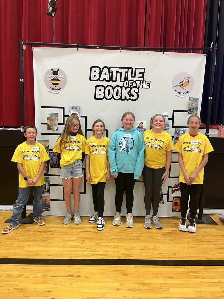 Students in front of Battle of the Books banner