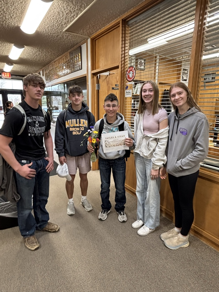 Botany students present Gunner with the flowers from the greenhouse