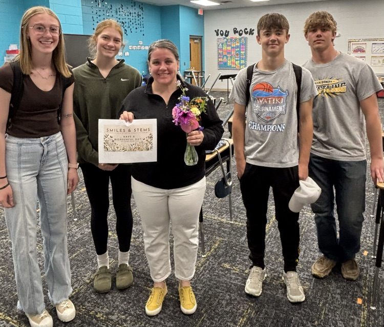 Ms Coons with her bouquet from the Botany students.