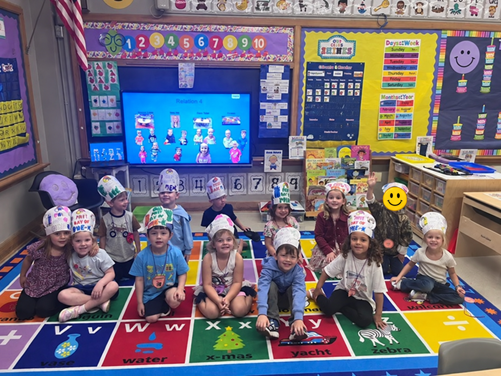 A group of students wearing decorated crowns