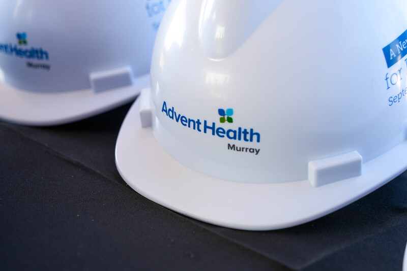 AdventHealth hard hat on black table
