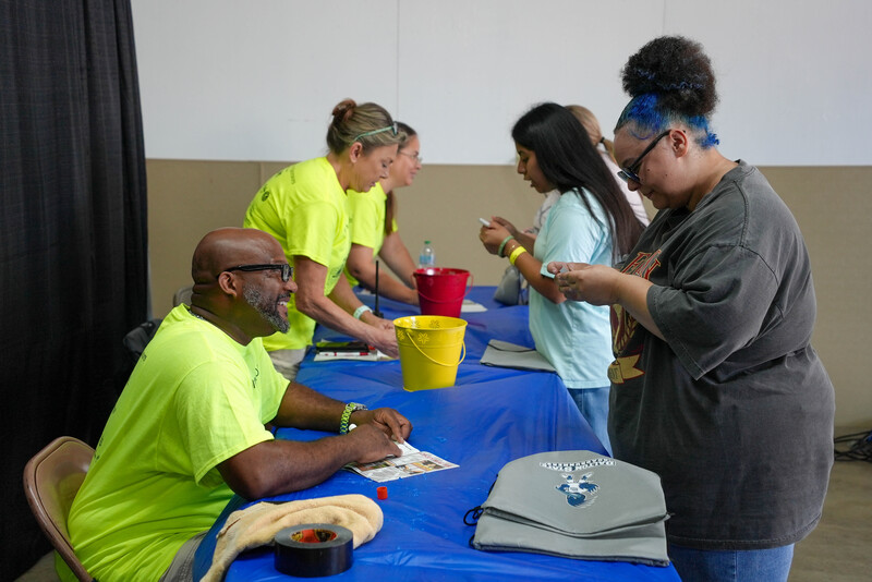 Volunteers helping students