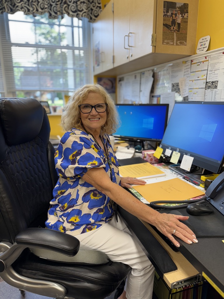 Mrs. Butler at Desk