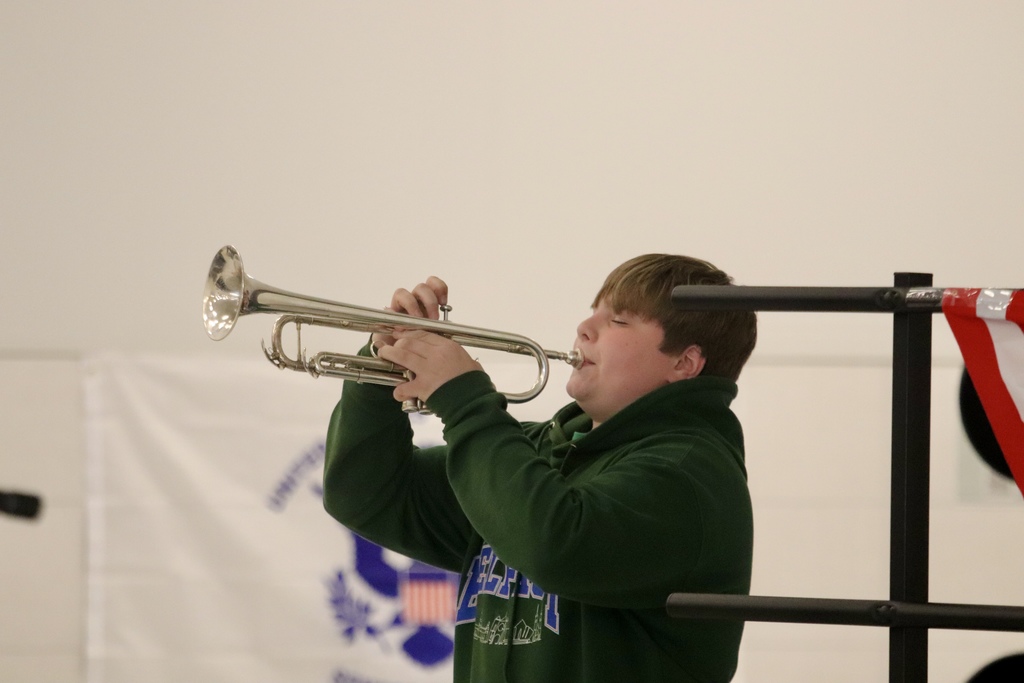 kid playing trumpet 
