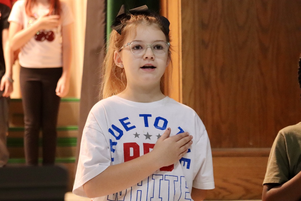 Kid singing National Anthem 