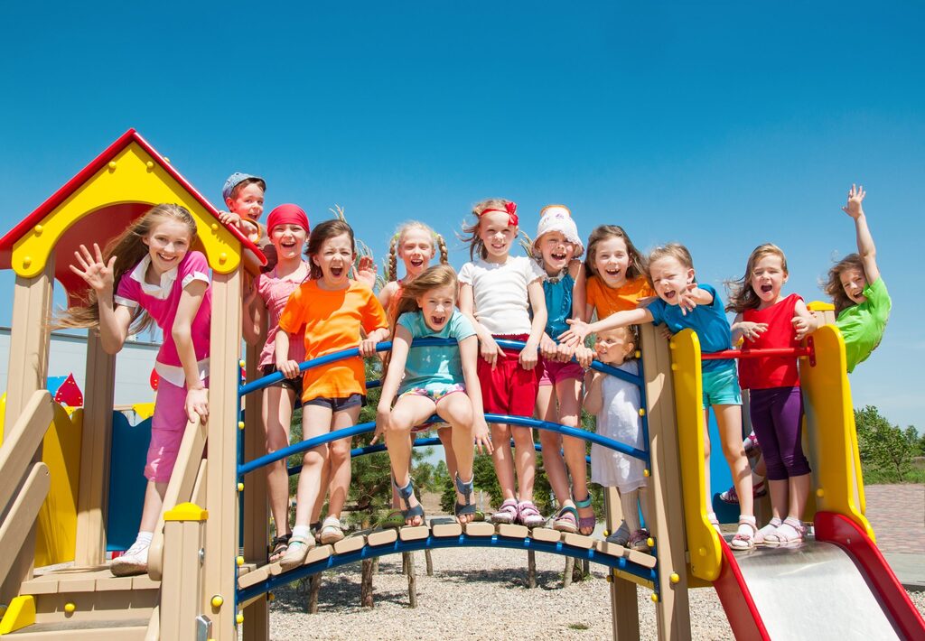 kids doing summer activities. 13 kids on a play structure