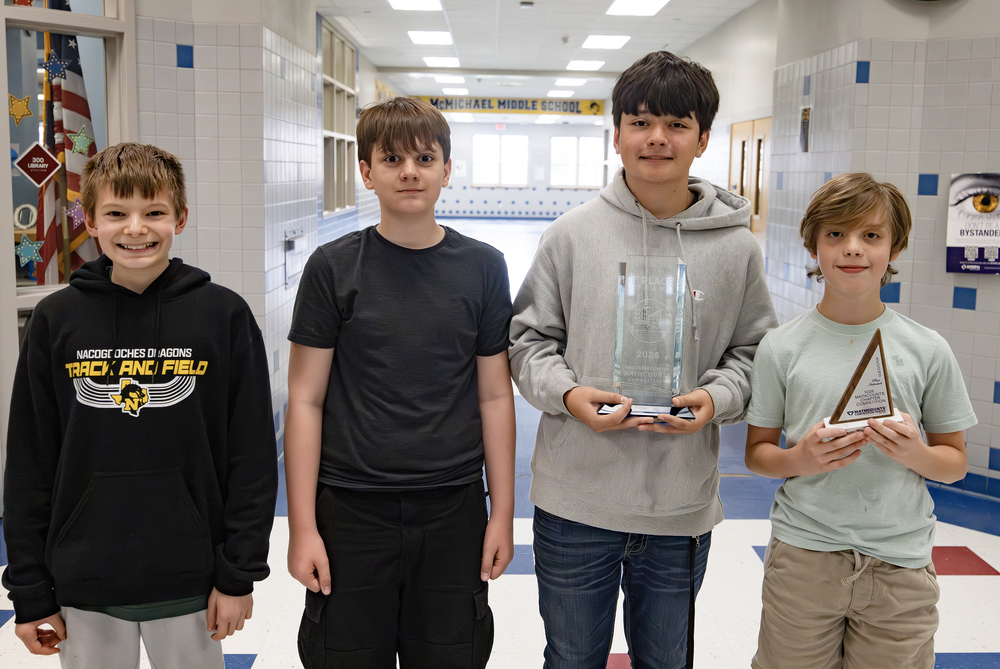 MathCounts students holding trophies
