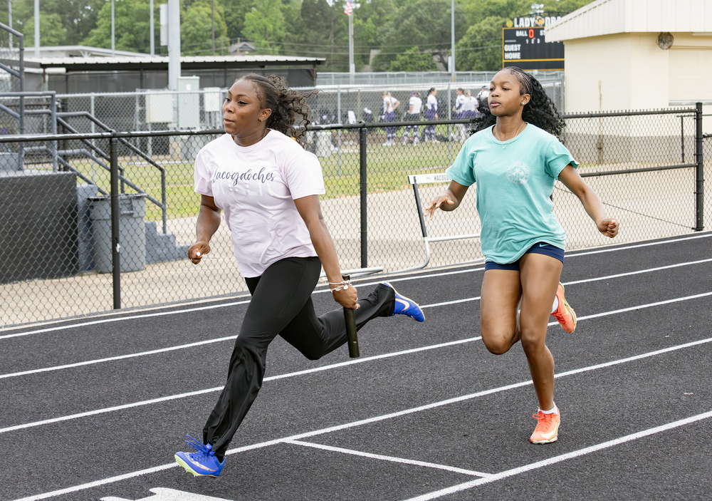 Relay team practices baton handoff