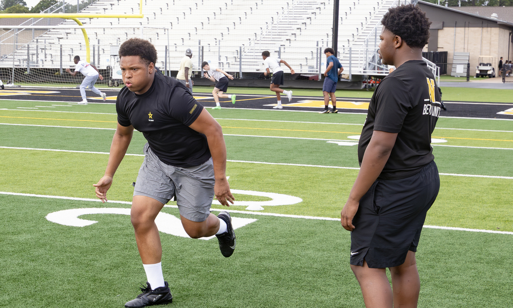 Dragon linemen goes through drills at Dragon Stadium