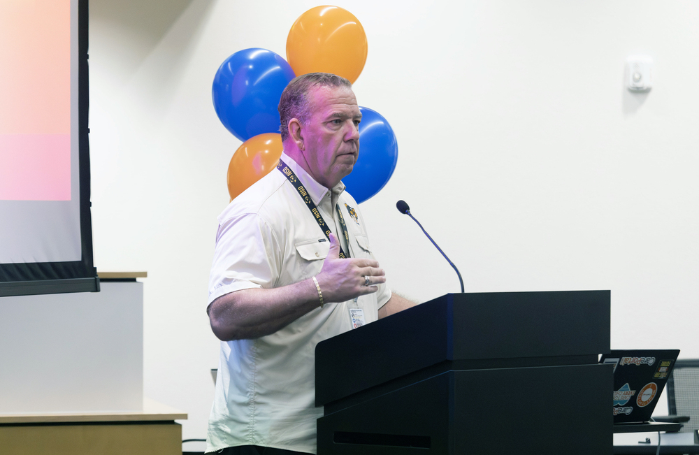 Superintendent Grey Burton speaks at podium