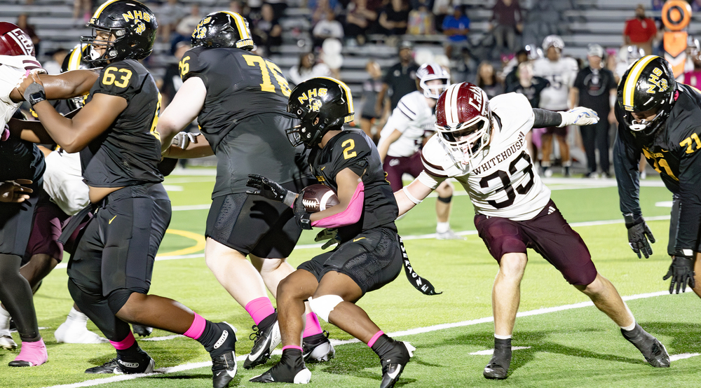 Dragons football player carries ball