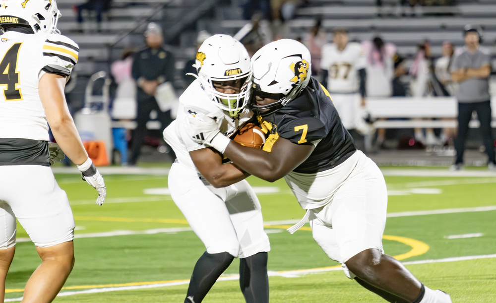 Dragons football player makes a tackle