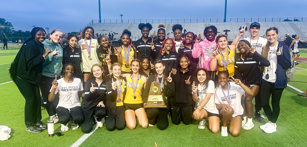 Lady Dragons track team with district trophy