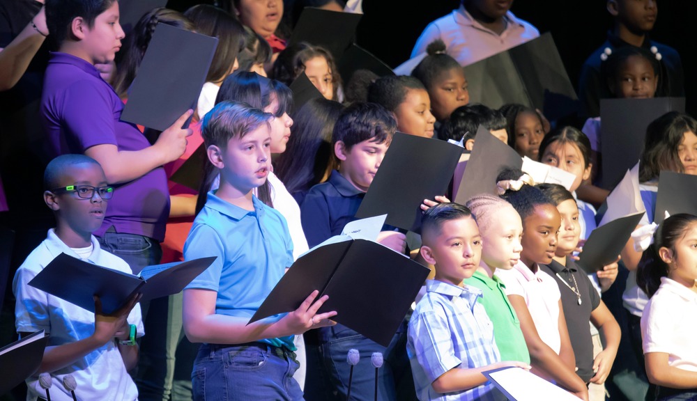 Elementary students singing in combined choir