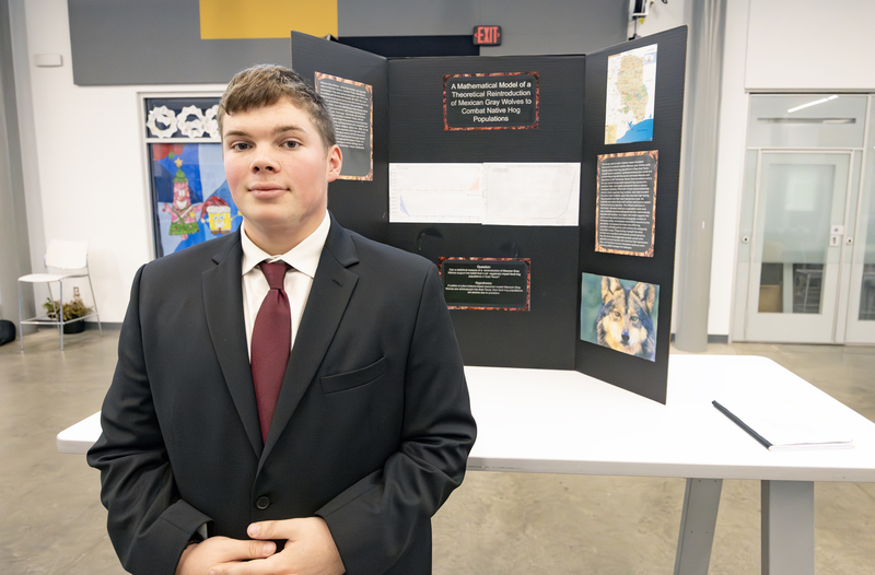 Students in front of project