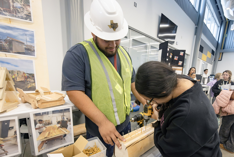 Student uses power drill