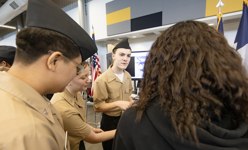Students answering questions from middle school students