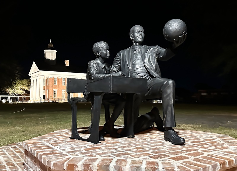 E.J. Campbell statue at night