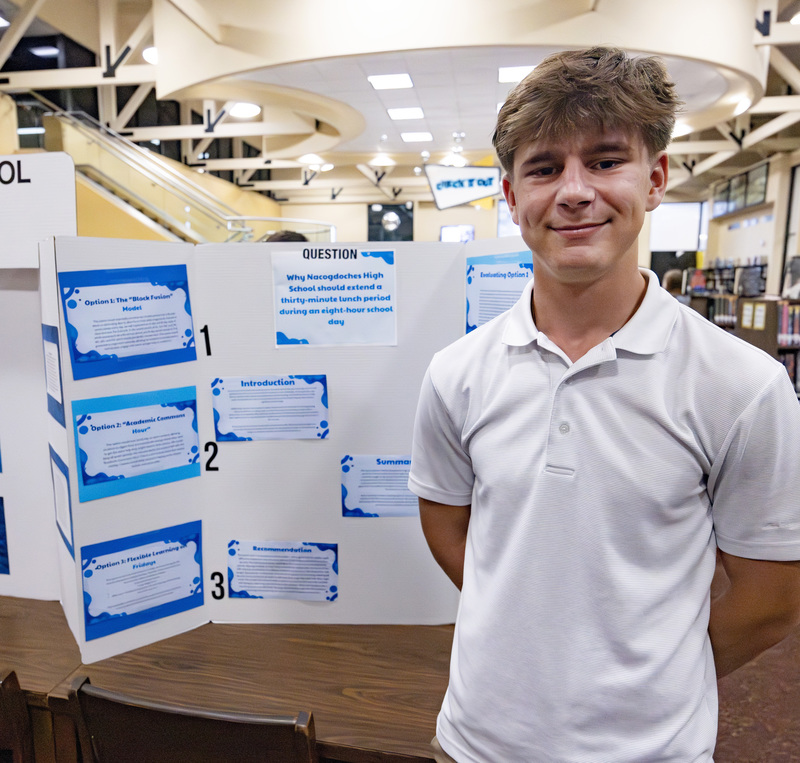 Student in front of project