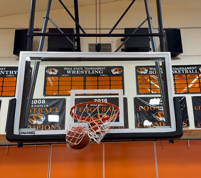A basketball going through the hoop in the Napavine high school gym