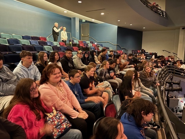 Napavine Art students sit in a theatre on a field trip