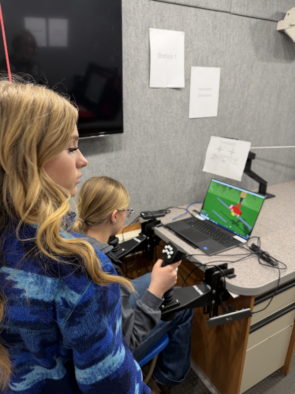 Girls taking agriculture classes get to try the harvester simulator