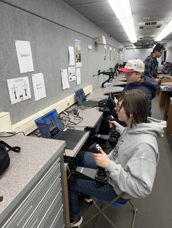 8th grade boys get to try the bulldozer simulator