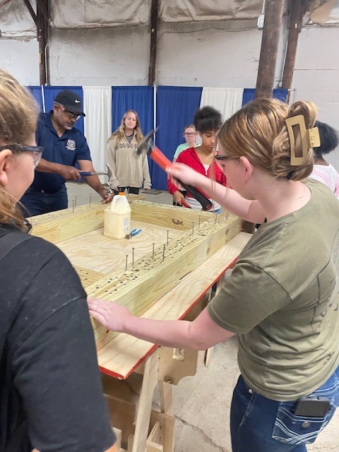 Ackerson High School students engaging in hands on activities in the skilled trade apprenticeship programs, watched industry professionals like architects and engineers in action, and connected with representatives from construction firms, educational institutions, and industry organizations.