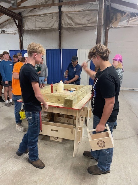 Ackerson High School students engaging in hands on activities in the skilled trade apprenticeship programs, watched industry professionals like architects and engineers in action, and connected with representatives from construction firms, educational institutions, and industry organizations.