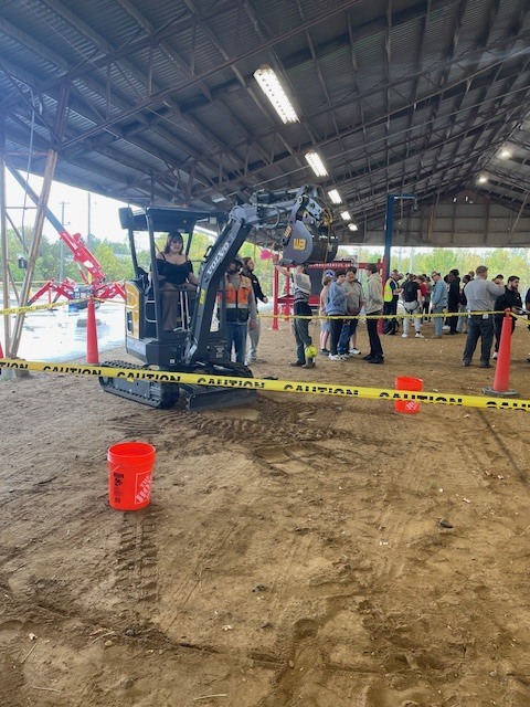 Ackerson High School students engaging in hands on activities in the skilled trade apprenticeship programs, watched industry professionals like architects and engineers in action, and connected with representatives from construction firms, educational institutions, and industry organizations.