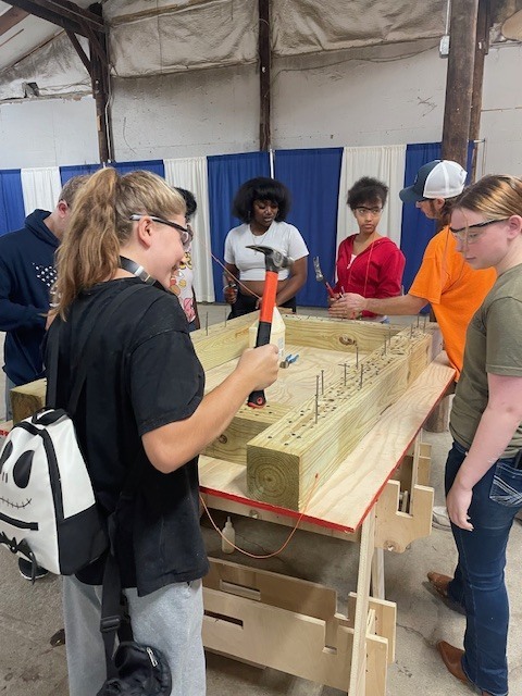 Ackerson High School students engaging in hands on activities in the skilled trade apprenticeship programs, watched industry professionals like architects and engineers in action, and connected with representatives from construction firms, educational institutions, and industry organizations.