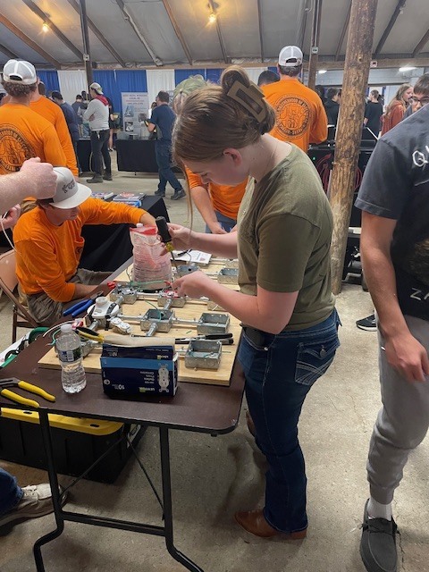 Ackerson High School students engaging in hands on activities in the skilled trade apprenticeship programs, watched industry professionals like architects and engineers in action, and connected with representatives from construction firms, educational institutions, and industry organizations.