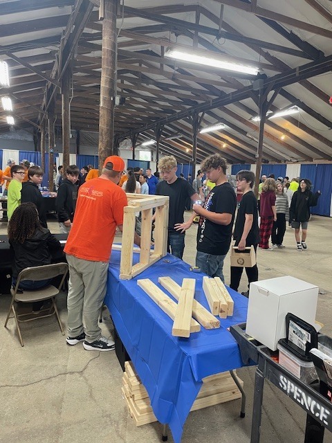 Ackerson High School students engaging in hands on activities in the skilled trade apprenticeship programs, watched industry professionals like architects and engineers in action, and connected with representatives from construction firms, educational institutions, and industry organizations.