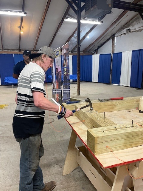 Ackerson High School students engaging in hands on activities in the skilled trade apprenticeship programs, watched industry professionals like architects and engineers in action, and connected with representatives from construction firms, educational institutions, and industry organizations.