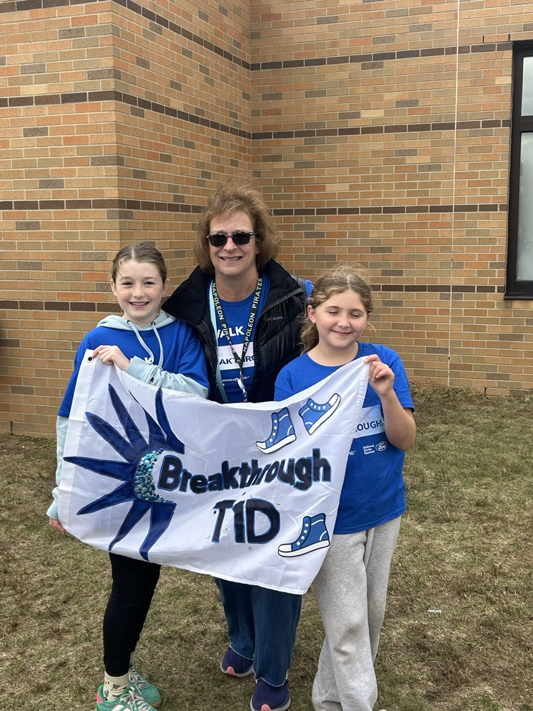two girls and woman holding a T1D banner