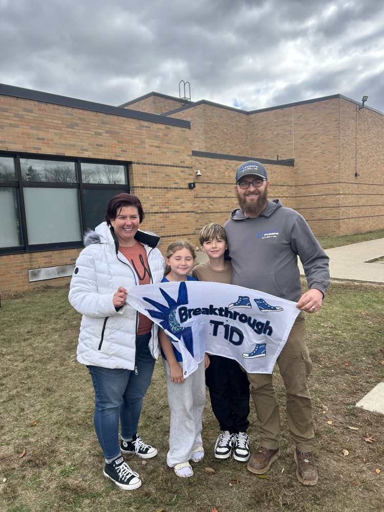 woman girl and man holding banner