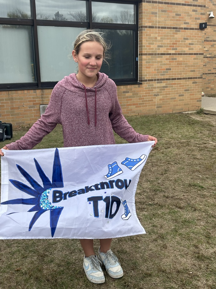 girl holding a banner
