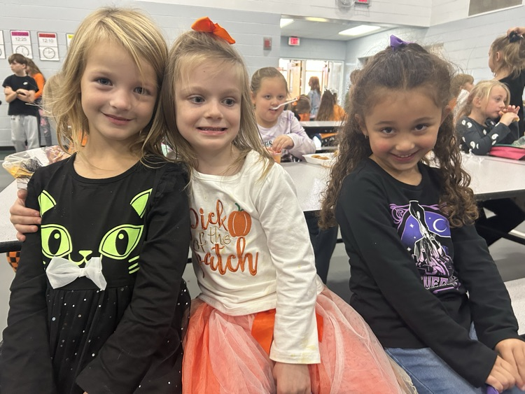 three girls in Halloween clothes