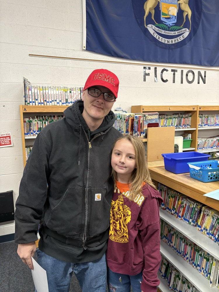 child with dad in library 