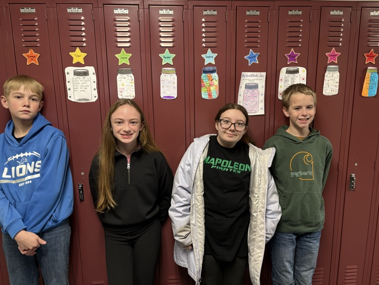 students standing in front of lockers