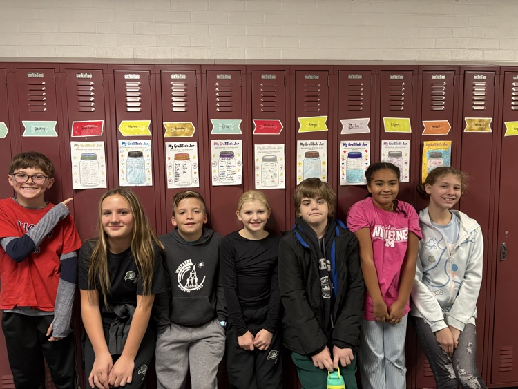students standing in front of lockers