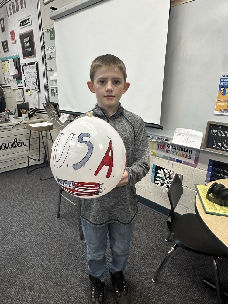 student holding a balloon